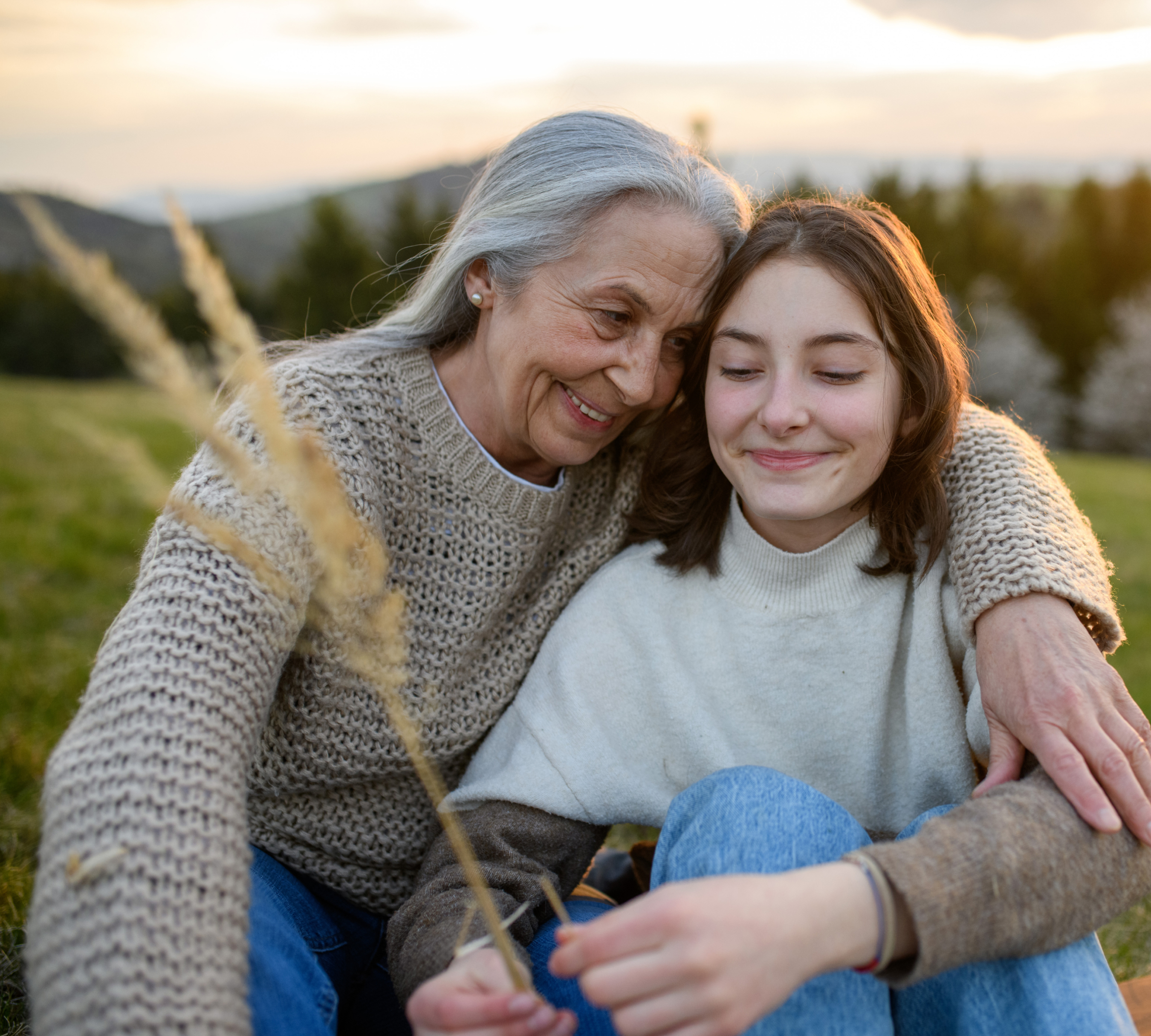 Grandmother hugging teenager